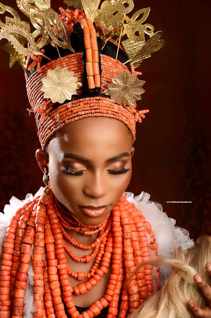 Close-up bridal portrait in traditional coral beads and ornate headwear
