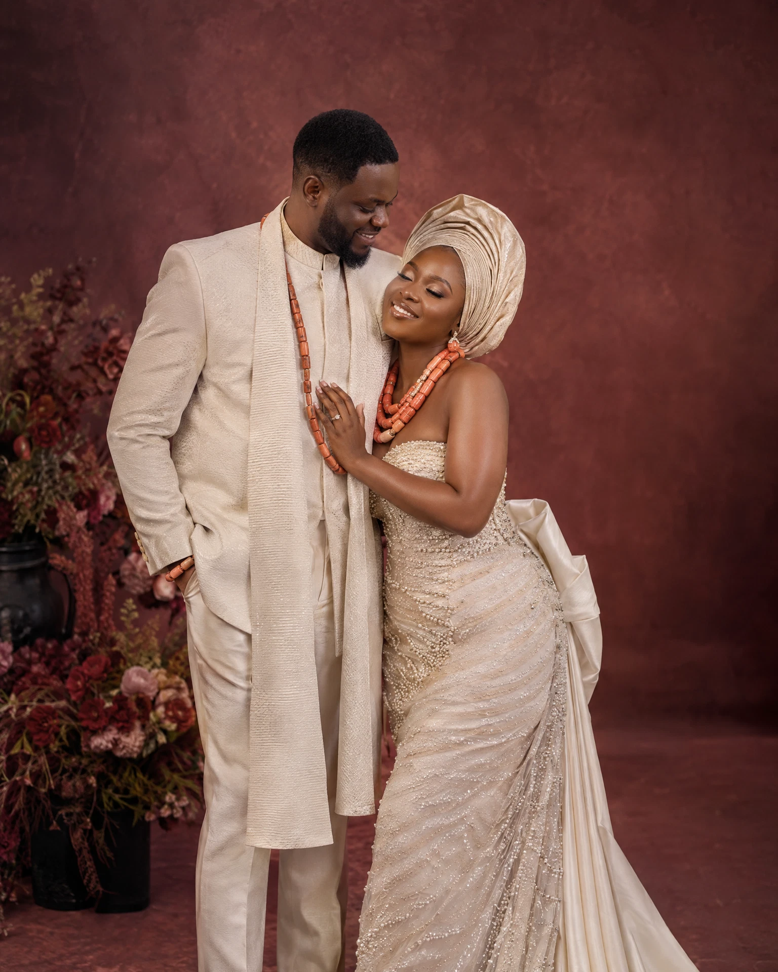 Generated studio concept: an adult Nigerian couple sharing a wedding portrait moment